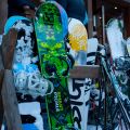 Skis and Snowboards standing outdoor